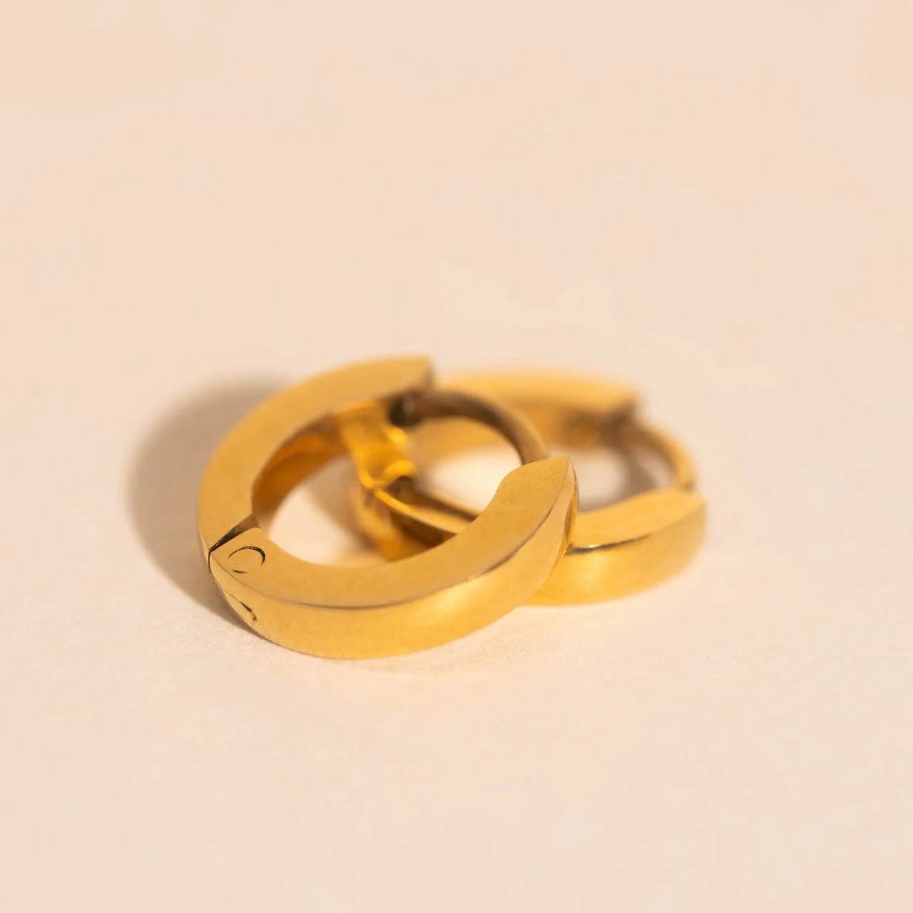 Smooth Tiny Huggie Hoop Earrings - Image 6